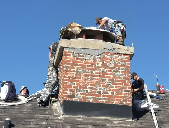 Gainesville Chimney Sweep installing a custom chimney crown in Gainesville, FL