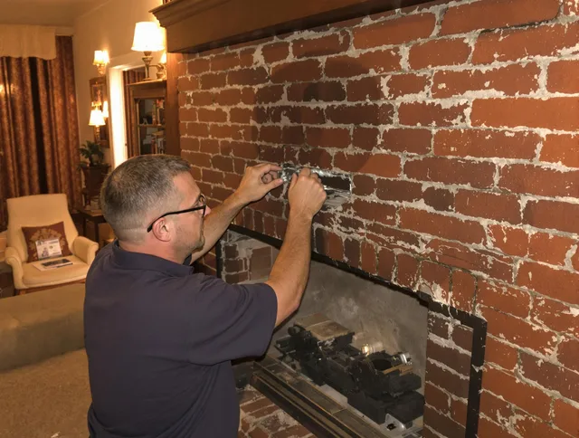 Gainesville Chimney Sweep expert fixing a fireplace in Gainesville, FL